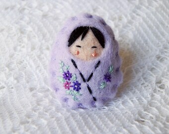 Hand embroidered felt brooch Kokeshi doll