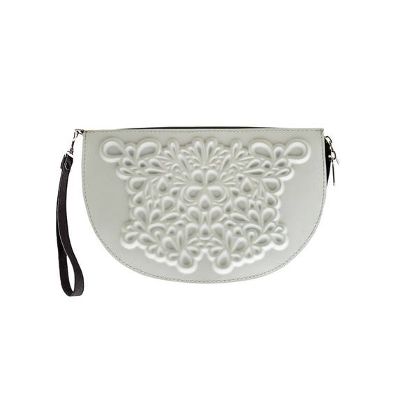 white wristlet clutch bag