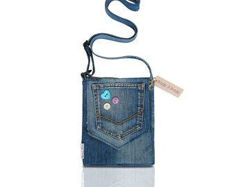 A unique denim jeans shoulder bag, fully lined, with front pocket and button detail.