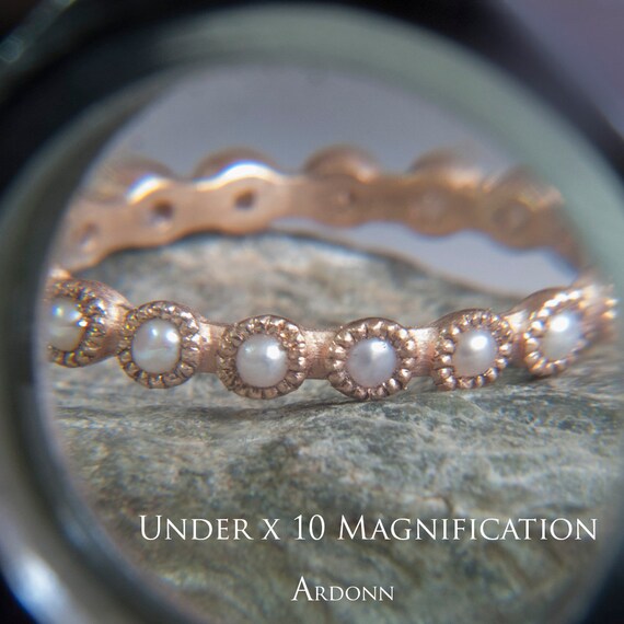 Eternity ring with white pearls