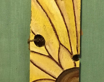 Hand painted sunflower on recycled wood.