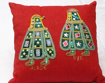 Decorative linen pillow features embroidery