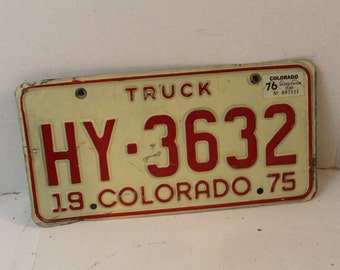 vintage 1975 Colorado Truck license plate HY-3632 red white