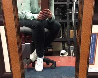 Faux ostrich framed mirror