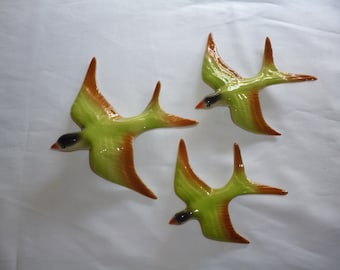 Ceramic flying swallows . Wall hanging