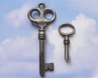 Keys, 2 different, antique. One has a decorative top & the other is tiny, they are skeleton keys, probably for boxes, steel. c 19th cent.