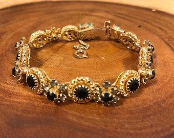 Alice Caviness black bracelet