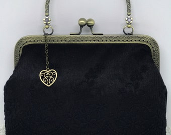 Vintage black handbag with purse
