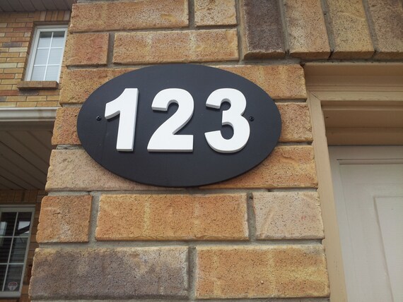 Outdoor house number plaque. House numbers. House number