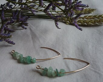 Gold bow earrings and gemstones
