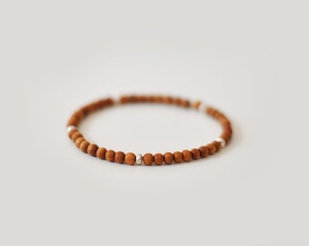 Sandalwood beaded stretch bracelet with thai silver beads