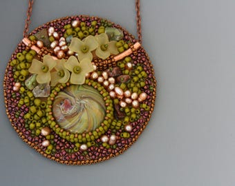 Bead embroidered pendant on a delicate copper chain necklace. Green and brown necklace. Floral theme. Glass, resin, pearls, ultrasuede.