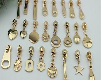 5# 10pcs light golden metal head zipper slider with 25 design puller , zipper slider whole sale . handbag hardware, bag supply