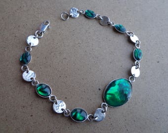 Silver (.925) bracelet with green Paua shells.