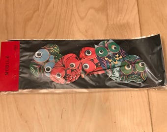 Vintage owl mobile with google eyes.