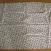 Christmas material, fabric, wreaths, bows, holly, white, red, green