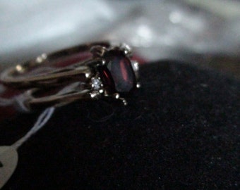 gold garnet and cz flip ring january birthstone