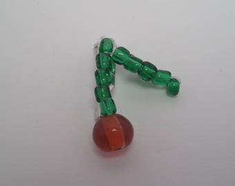 Red cherry fruit stem with dark green brooch