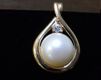Vintage Monet clip on pendant of zirconia and faux pearl