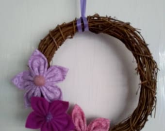 Rattan garland/wreath decorated with handsewn felt & fabric flowers