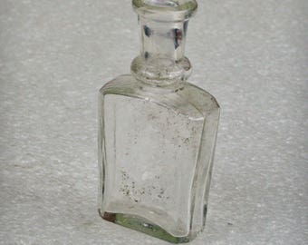 Antique glass bottle , medical or laboratory bottle . Vintage medical glass bottle