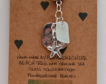 Silver necklace with sea glass and charms