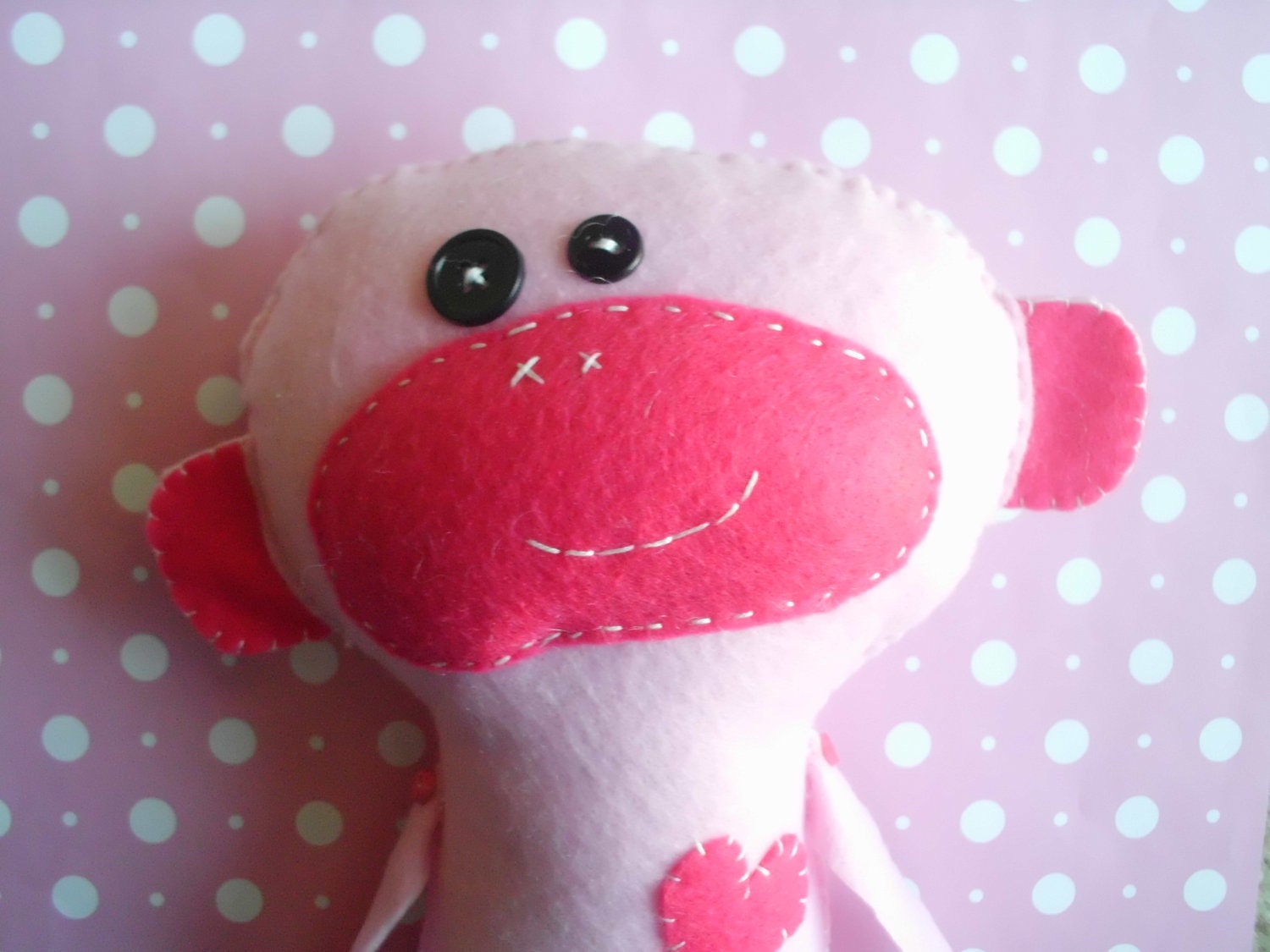 stuffed pink monkey