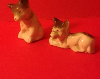 Two small ceramic dogs