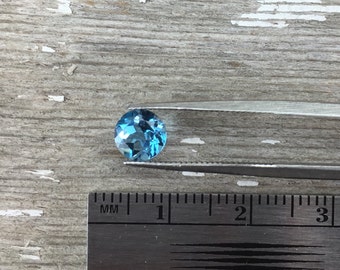 One 6mm faceted Swiss blue topaz semiprecious gemstone