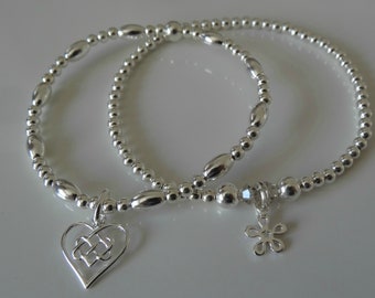 infinity and daisy stacking bracelets sterling silver by charmed