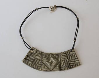 Made up of 3 square ridged Black ceramic bib necklace