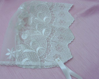 A Pretty Ivory Lace Baby Bonnet in various sizes.