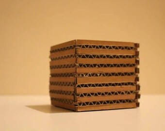 Cardboard faux candle Sconce