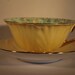 Art Deco Shelley Oleander Chintz Cup and Saucer - Yellow and Gold With Green and White Daisies 1940's