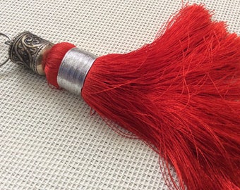 Red jewelry/sabra silk tassel with carved metal bead
