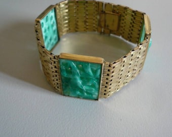 Art deco style 1950s green peking glass and gold tone metal bracelet.