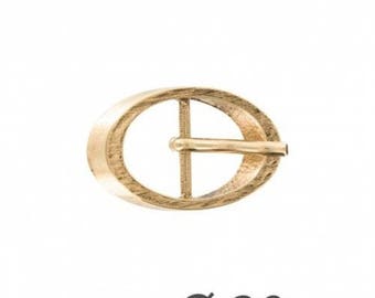 Golden oval belt buckle