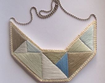 Geometric statement bib necklace hand embroidered silvery grays and blues Winter fashion