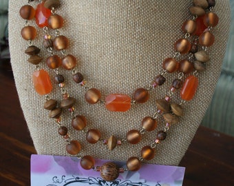 Lovely linked beaded necklace in orange and brown