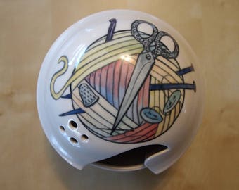 yarn bowl with scissors and rainbow yarn