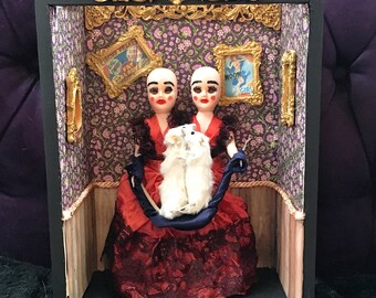 Conjoined twins taxidermy art. Freakshow conjoined Siamese twins in carnival sideshow w/ mice