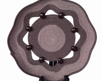 Large rope art plate dyed in two shades of brown with decorative beads