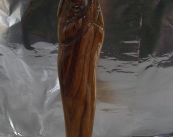 Big sculpture Madonna with Child. Virgin with the Child, in wood. Statue of the Virgin with the Child. Virgin Mary with Child wooden statue