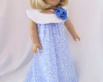 Sleeveless bubble dress in a sky blue floral print for 18 inch dolls
