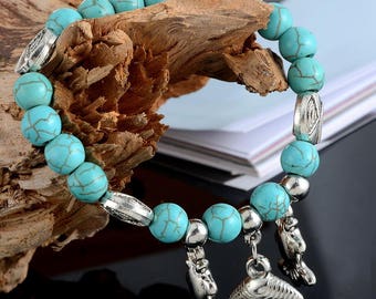 x 1 elastic bracelet beads turquoise/trinkets fish, shell, 19 cm