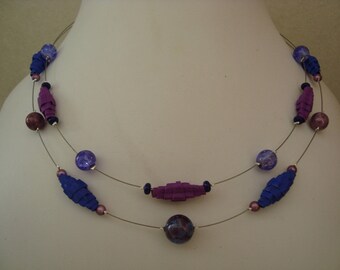 Necklace made of corrugated cardboard and glass beads