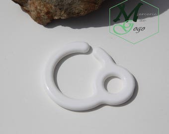 Hook or hook for white baby toy.