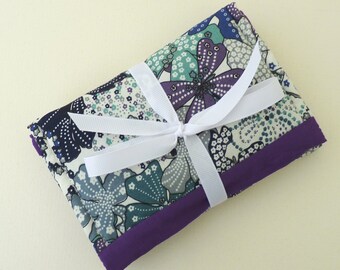 Travel sewing kit in purple floral design.