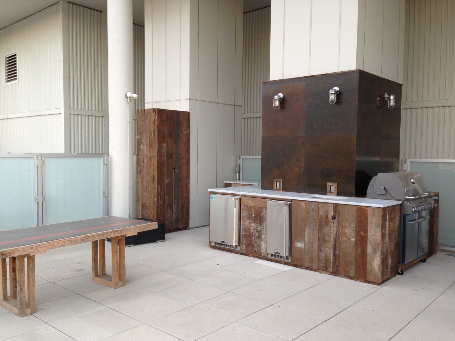 Custom Outdoor Kitchen with Reclaimed Wood Carrara