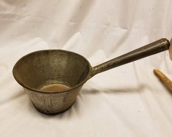 Antique metal Ladle 6 1/2" opening 3 3/4" deep.